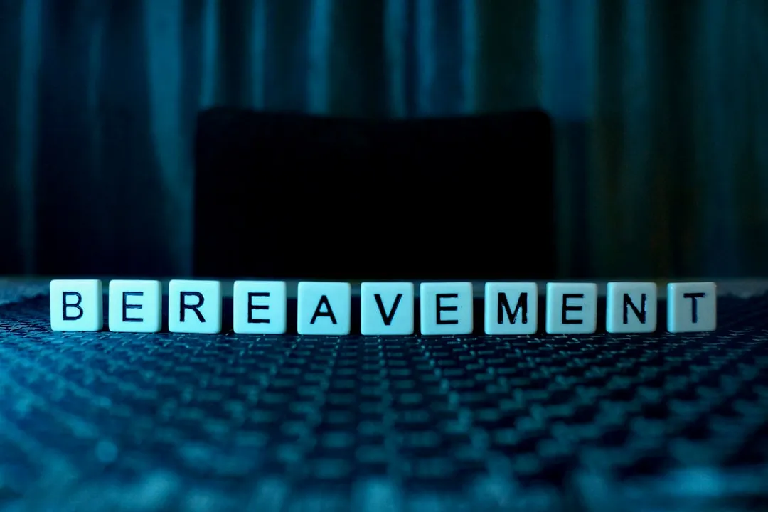 the word bereavement spelled with cubes on a table