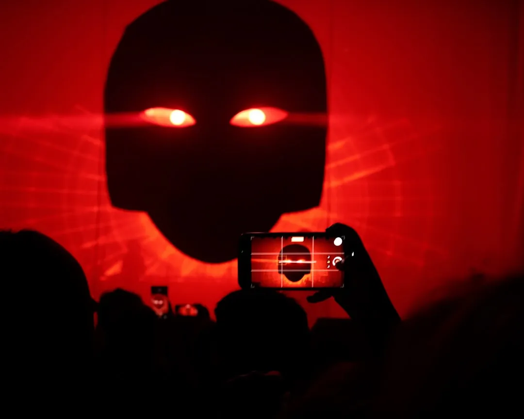 A person taking a picture with a cell phone