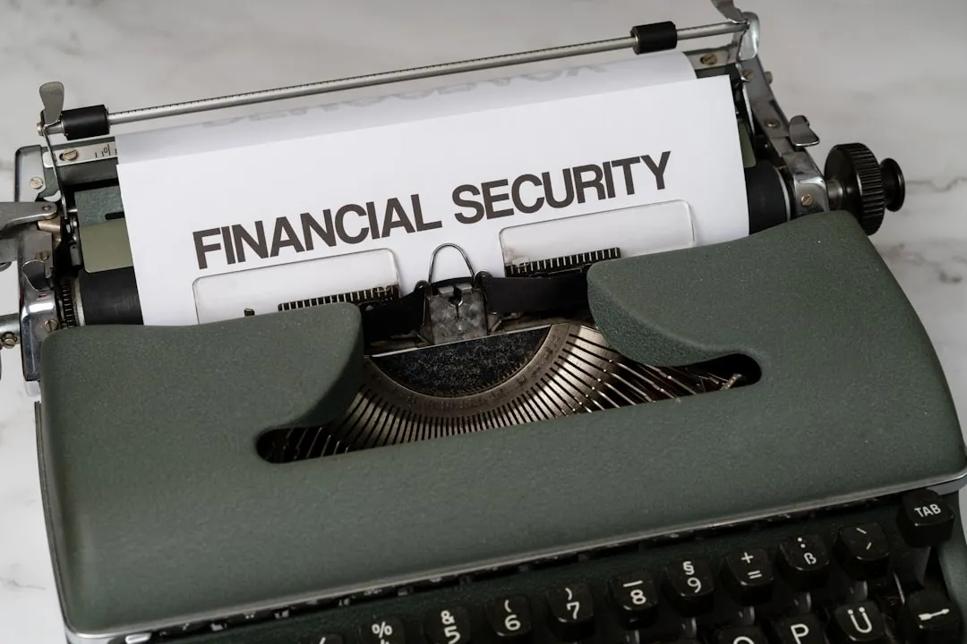a close up of a typewriter with a financial security sign on it