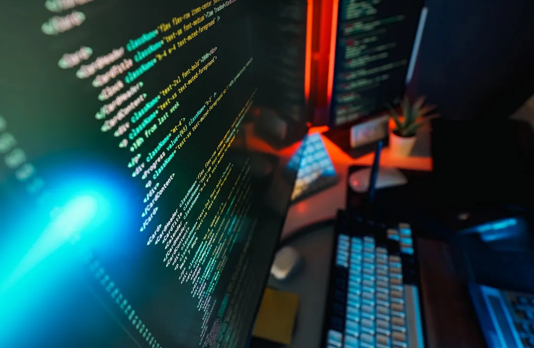 Code displayed on computer screens.